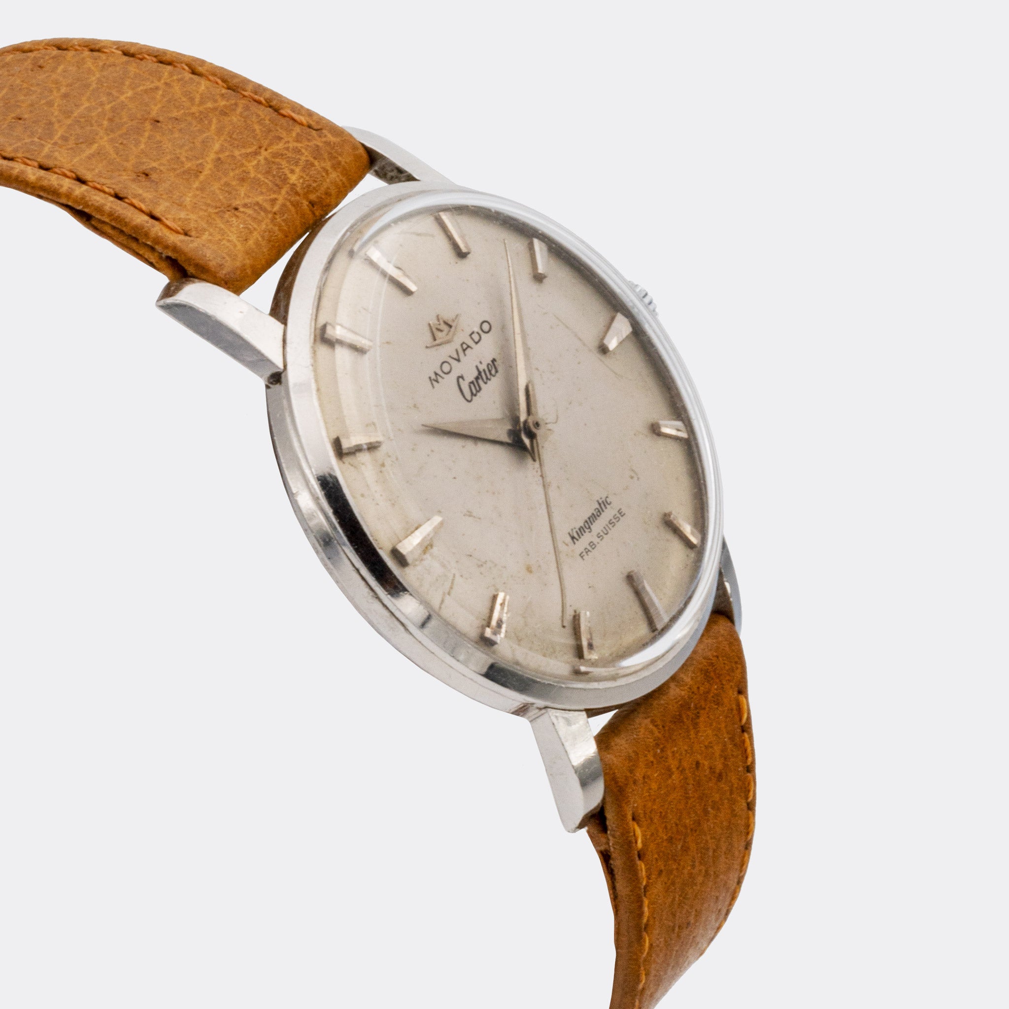 MOVADO | by CARTIER - double signed | Kingmatic | Fab. Suisse | Sword Hand | Cream Patined Dial | 1960s